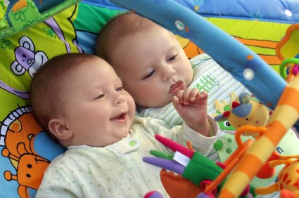 two baby boys playing